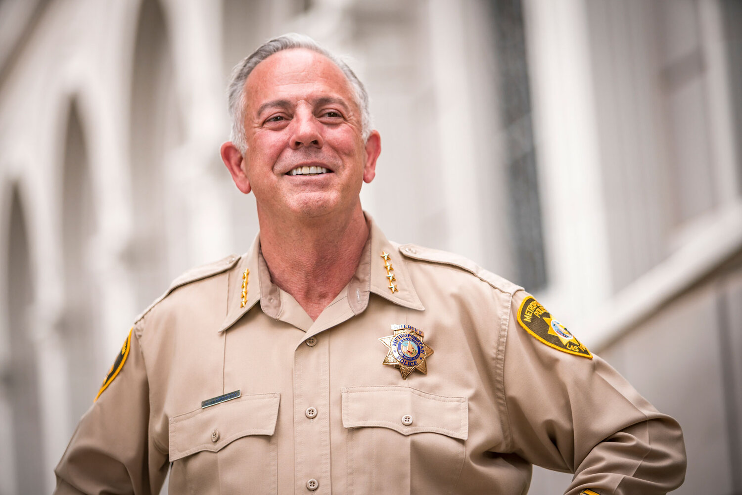 Las Vegas police Assistant Sheriff Joe Lombardo center hugs his